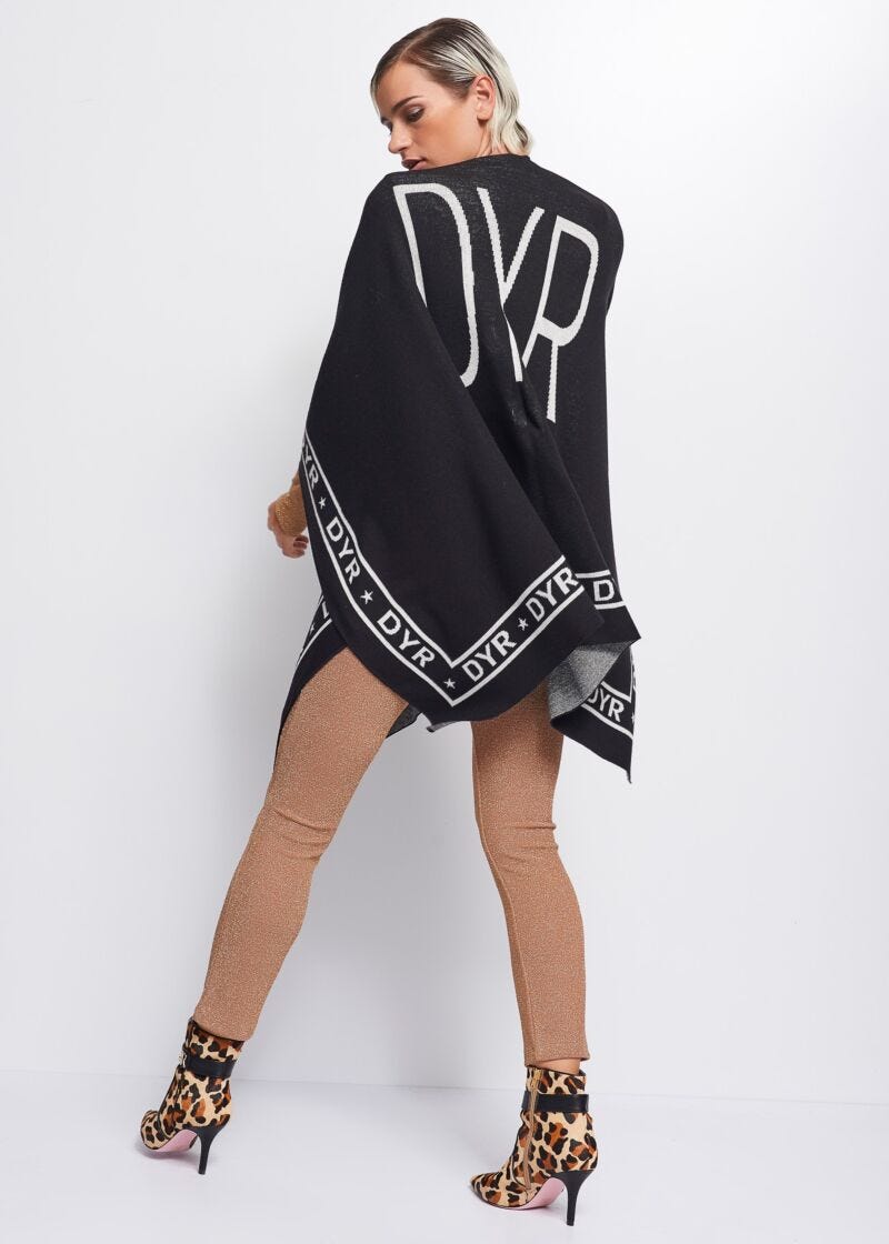 Knit cape with logo