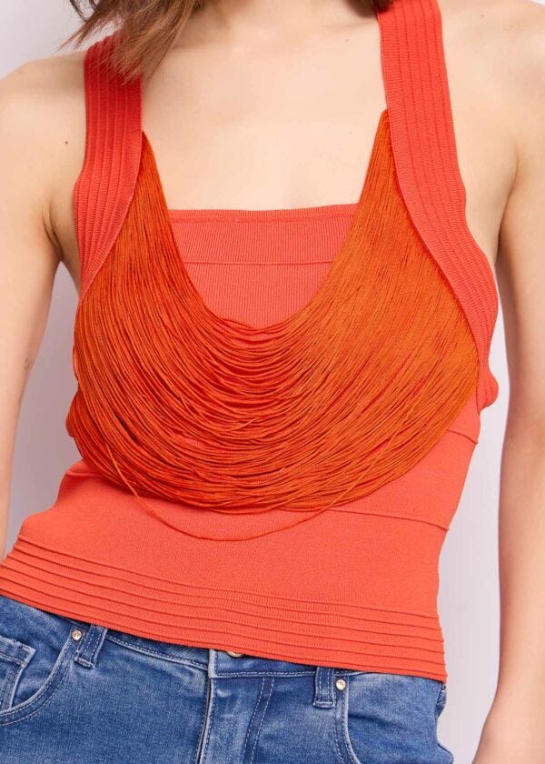Orange knit top with fringes
