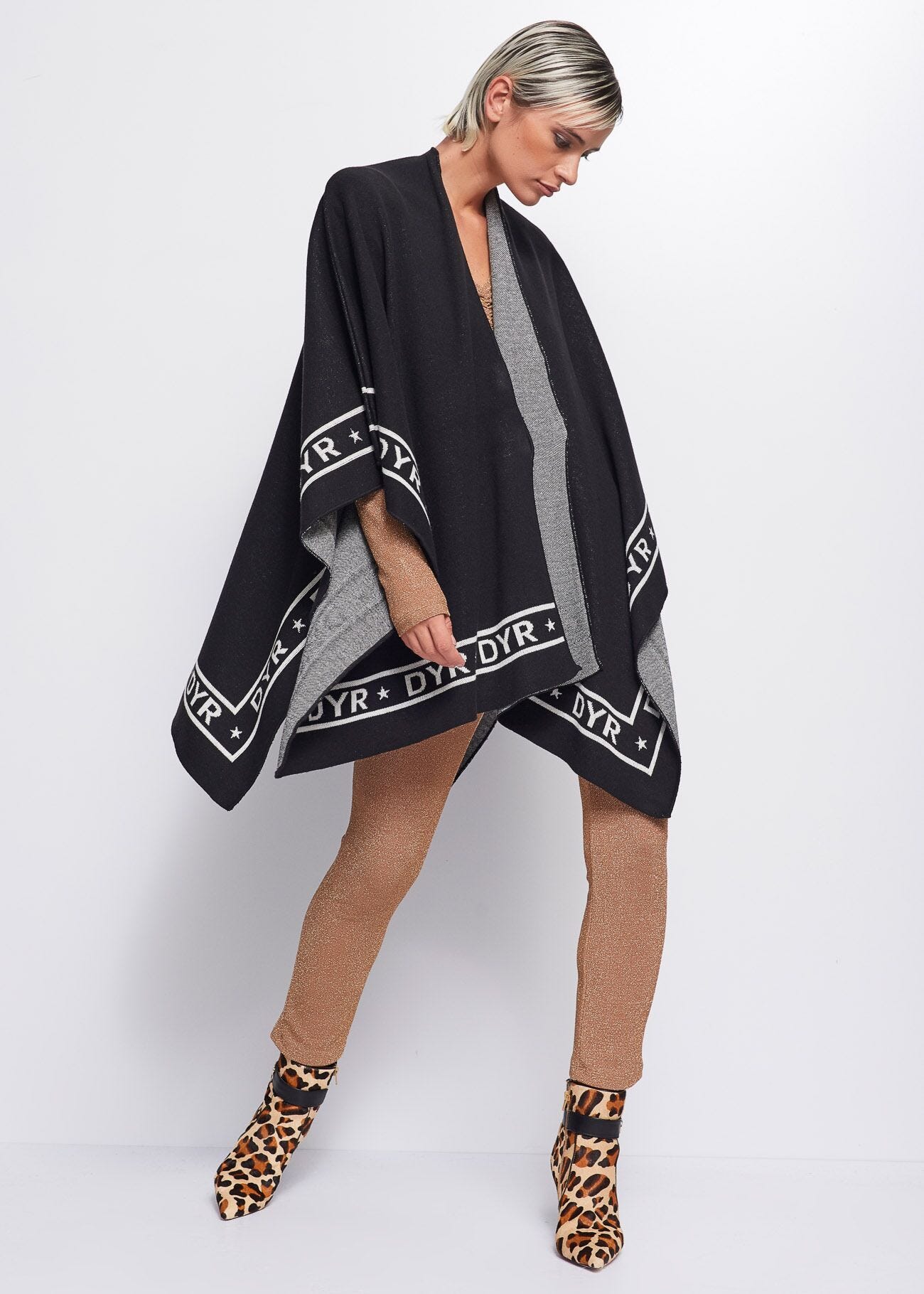 Knit cape with logo