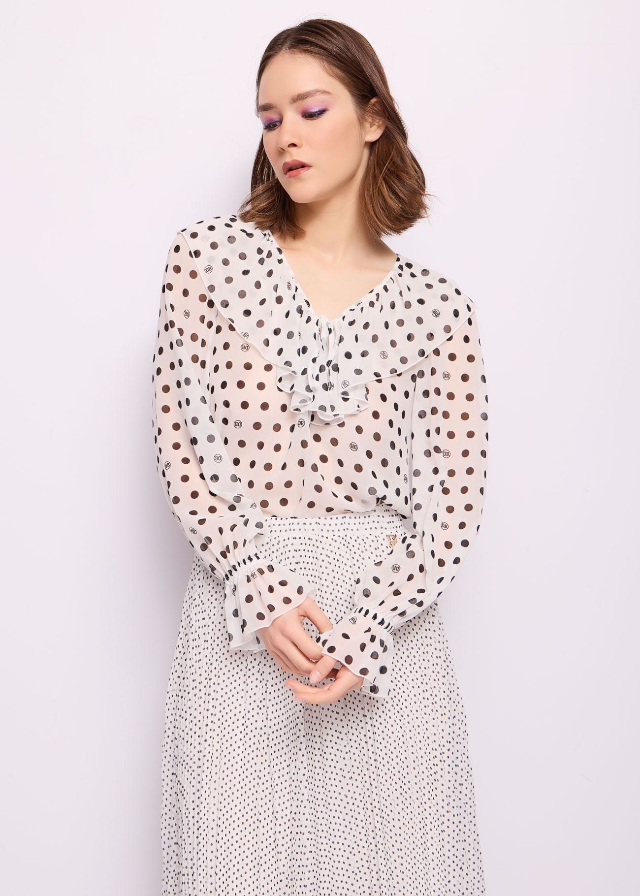 Blusa bianca in georgette a pois
