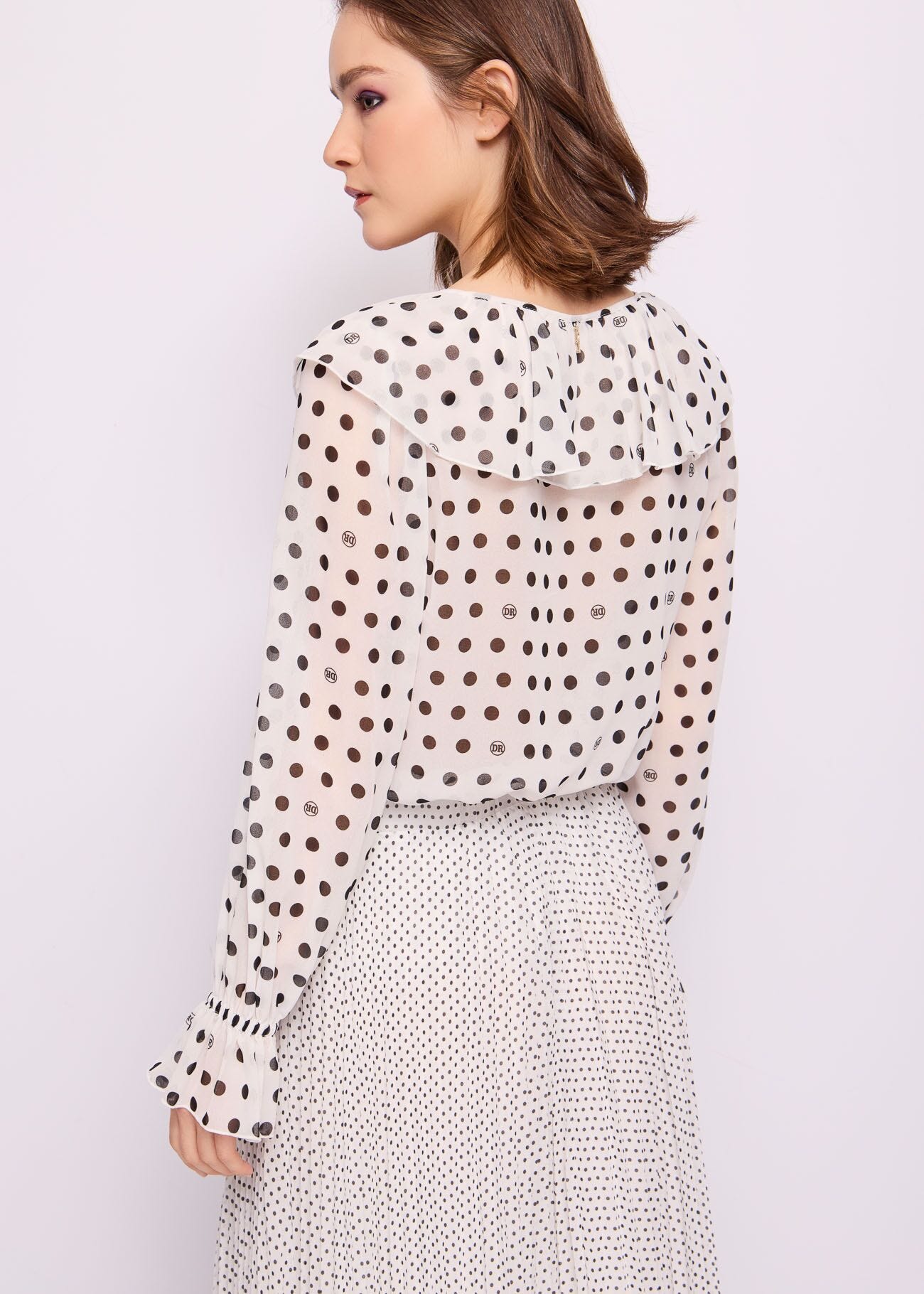 Blusa bianca in georgette a pois
